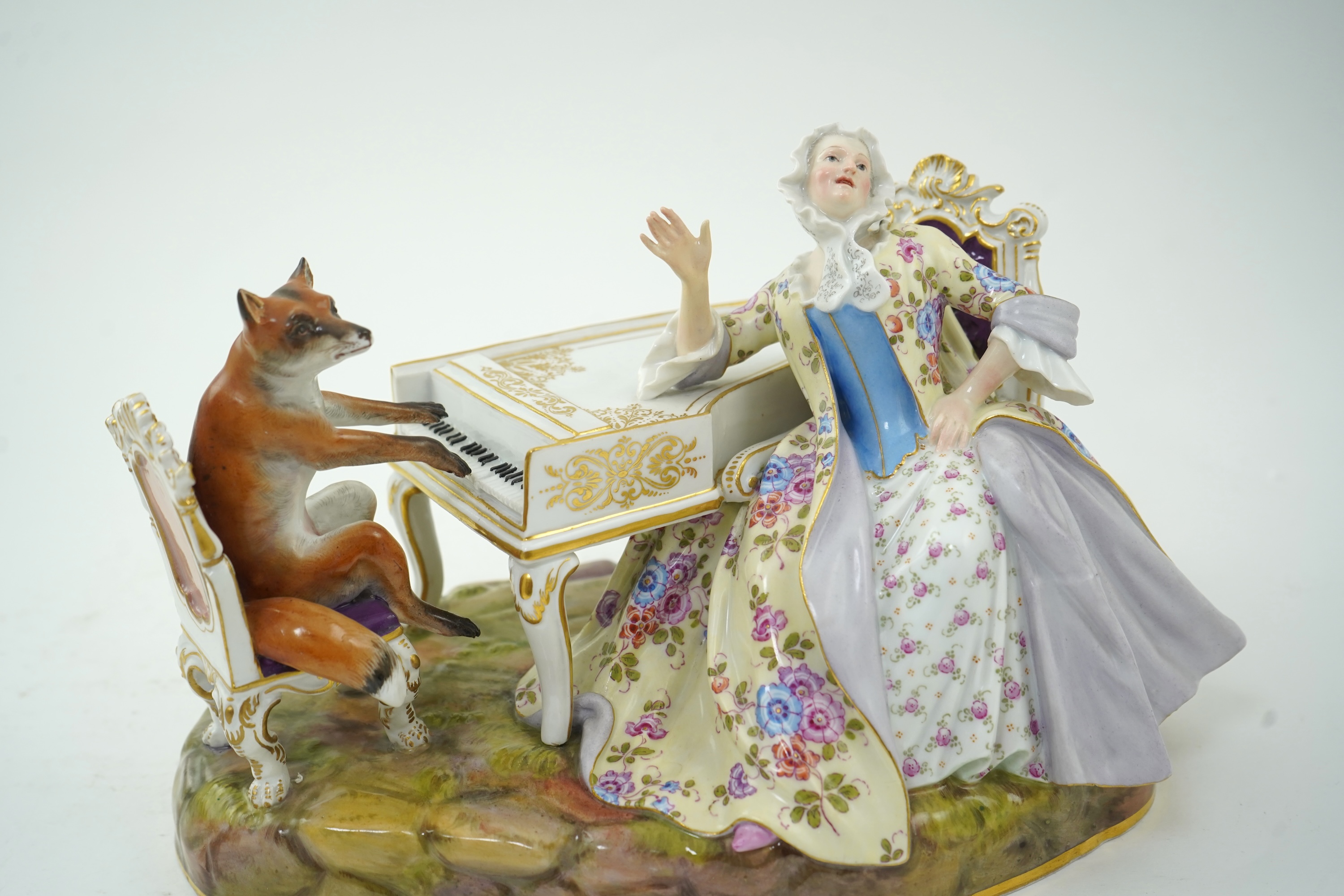 A Meissen group of a fox at the piano and a lady listening, after J. J. Kandler, late 19th century